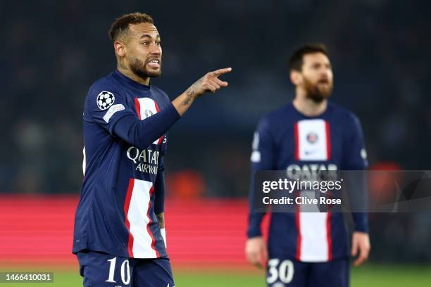 Neymar and Lionel Messi of Paris Saint-Germain look on during the UEFA Champions League round of 16 leg one match between Paris Saint-Germain and FC...