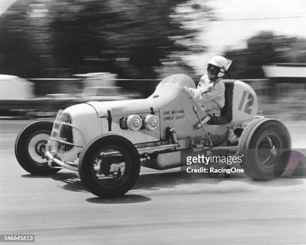 Sammy Packard broadslides his Sprint Car during a race in the late-1940s. Packard, originally from Barrington, RI, began racing Midgets in 1937 and,...
