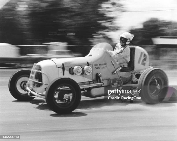 Sammy Packard broadslides his Sprint Car during a race in the late-1940s. Packard, originally from Barrington, RI, began racing Midgets in 1937 and,...