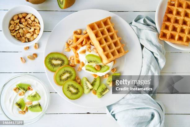 waffles, kiwi and peanuts - peanut food stock pictures, royalty-free photos & images