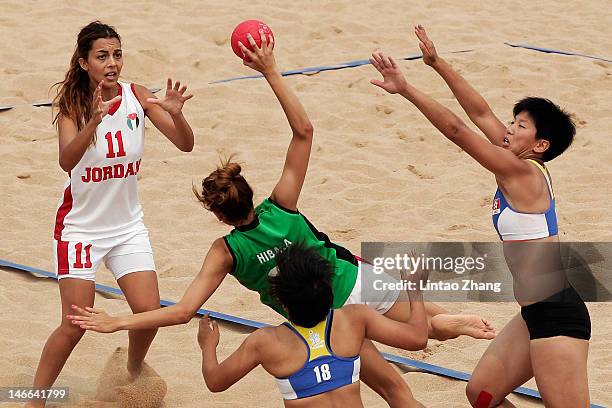 Hiba Ala-of Jordan is challenged by Sin Man Ng of Hong Kong China during the Beach Handball Women's Team Finals Match for 7/8 on Day 5 of the 3rd...