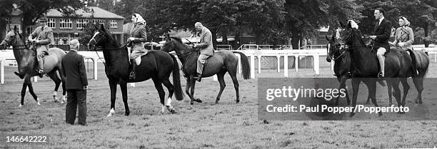 Queen Elizabeth II and her party on Ascot racecourse, 16th June 1960. From left to right, Lord Porchester, the 16th Duke of Norfolk , the Queen, the...