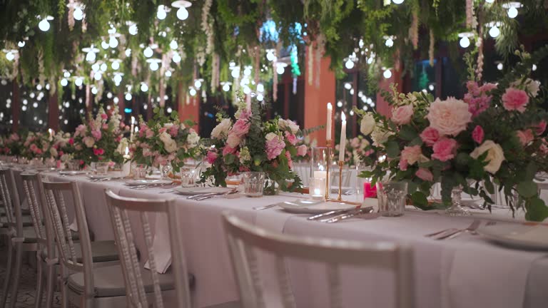 https://media.gettyimages.com/id/1466423824/video/dinner-setting-up-festive-table-decorations-wedding-party-night-reception-parallax-shot.jpg?b=1&s=640x640&k=20&c=vMqWe9b2JhPuMWgysFtdSZhyFFL5yWdELXHHGop9zGA=