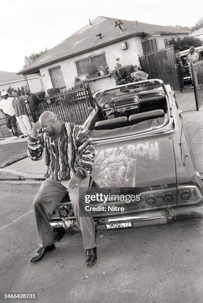 Death Row Music Executive Marion "Suge" Knight sits on his Chevy convertible in front of the home he grew up in, in Compton, California circa 1995.