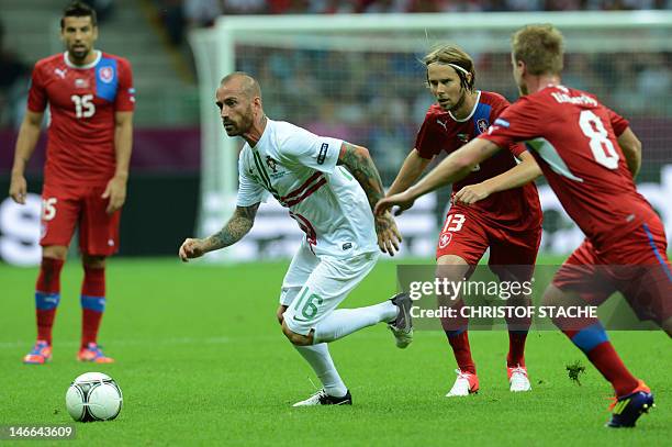 Portuguese midfielder Raul Meireles runs with the ball past Czech midfielder Jaroslav Plasil during the Euro 2012 football championships...