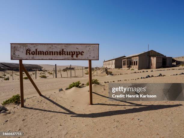 exterior of abandoned building in the ghost town kolmanskop, namibia - kolmanskop namibia stock pictures, royalty-free photos & images