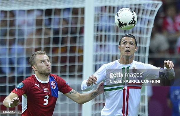 Czech defender Michal Kadlec vies with Portuguese forward Cristiano Ronaldo during the Euro 2012 football championships quarter-final match between...