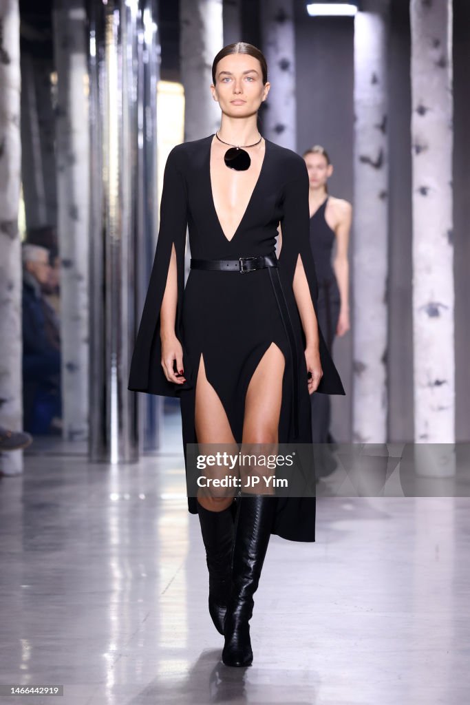 a-model-walks-the-runway-during-the-michael-kors-collection-fall-winter-2023-runway-show-on.jpg
