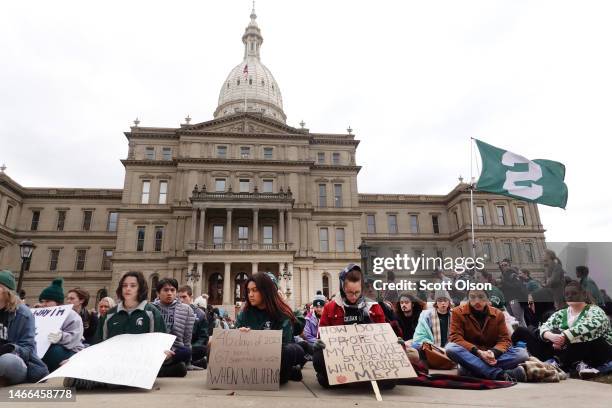 Current and former students from Michigan State University and their supporters attend a rally outside of the state Capitol Building on February 15,...