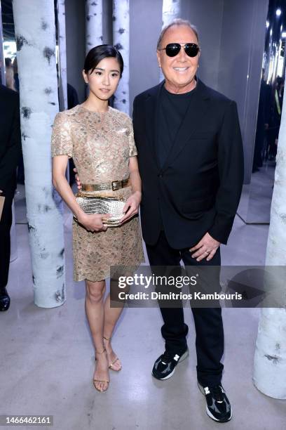 Yuina and Michael Kors attend the Michael Kors Collection Fall/Winter 2023 Runway Show on February 15, 2023 in New York City.