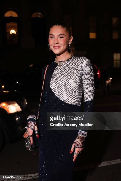 Stefanie Giesinger seen wearing full Tory Burch look, two tone navy silver shiny net dress, silver bucket bag, silver chain and rings outside Tory...