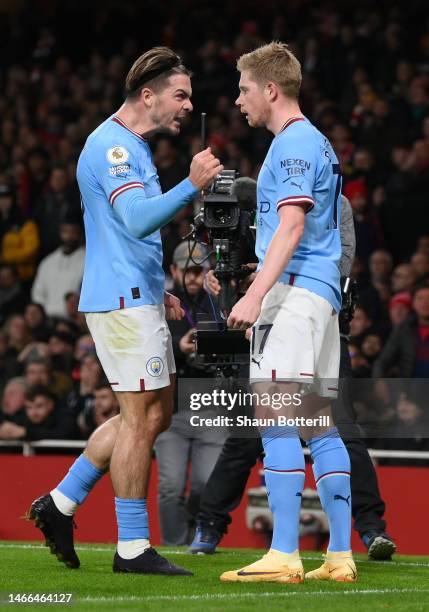 Kevin De Bruyne of Manchester City celebrates with teammate Jack Grealish after scoring the team's first goal during the Premier League match between...