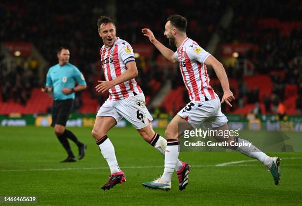 Phil Jagielka of Stoke City celebrates with team mate Morgan Fox after scoring their sides first goal during the Sky Bet Championship between Stoke...