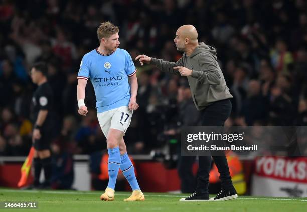 Kevin De Bruyne of Manchester City speaks with Pep Guardiola, Manager of Manchester City, during the Premier League match between Arsenal FC and...