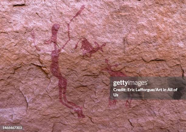 Rock painting depicting hunting gazelles, Tassili N'Ajjer National Park, Tadrart Rouge, Algeria on December 30, 2022 in Tadrart Rouge, Algeria.