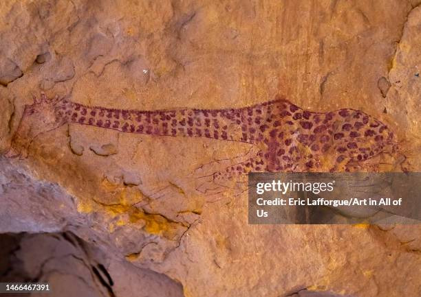 Rock painting depicting a giraffe sleeping, Tassili N'Ajjer National Park, Tadrart Rouge, Algeria on December 30, 2022 in Tadrart Rouge, Algeria.