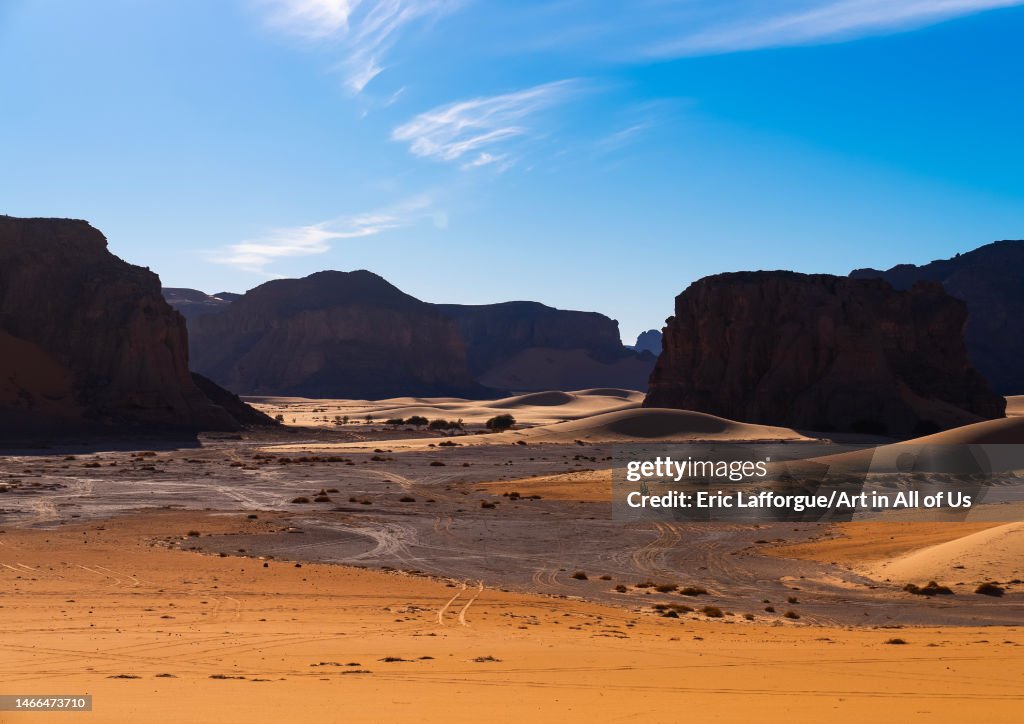 Rocks and sand dunes in Sahara desert, Tassili N'Ajjer National Park, Tadrart Rouge, Algeria...