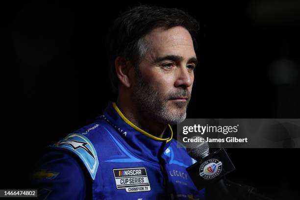 Jimmie Johnson, driver of the Carvana Chevrolet, speaks to the media during the NASCAR Cup Series 65th Annual Daytona 500 Media Day at Daytona...
