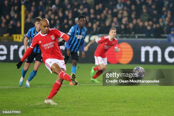 Joao Mario of Benfica scores their sides first goal from the penalty spot during the UEFA Champions League round of 16 match between Club Brugge KV...