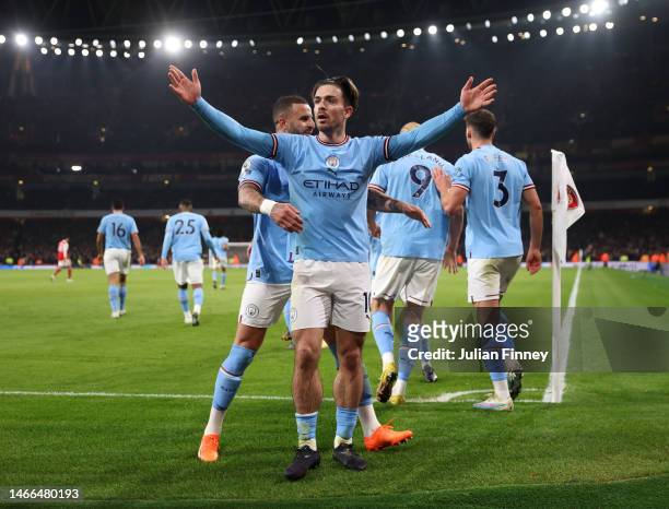 Jack Grealish of Manchester City celebrates after scoring the team's second goal with teammates during the Premier League match between Arsenal FC...