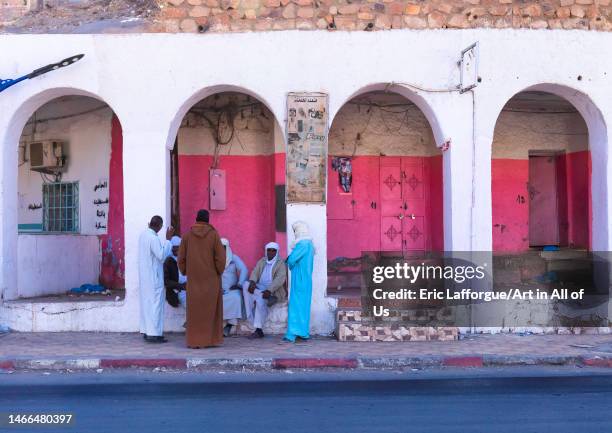 Tuareg men chatting under arcades in the city, North Africa, Djanet, Algeria on January 2, 2023 in Djanet, Algeria.