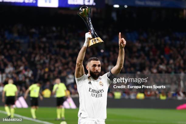 Karim Benzema of Real Madrid shows the Club World Cup trophy to the fans during the spanish league, La Liga Santander, football match played between...