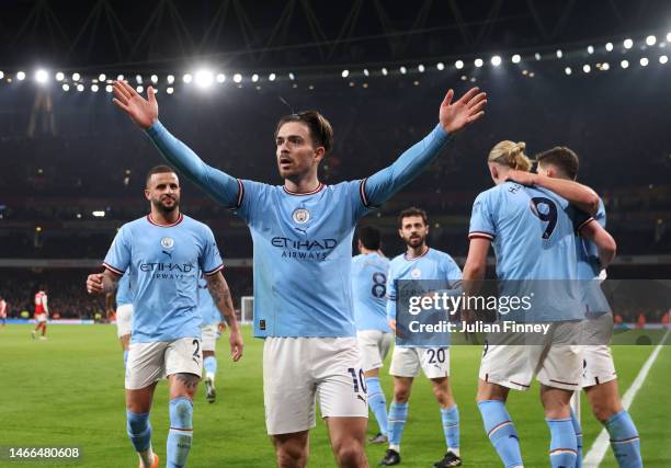 Jack Grealish of Manchester City celebrates after scoring the team's second goal with teammates during the Premier League match between Arsenal FC...