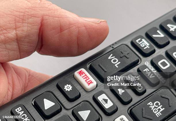 Detail of TV remote control with Netflix and Amazon Prime streaming platform buttons is seen on February 11, 2023 in Cornwall, England. Netflix is a...