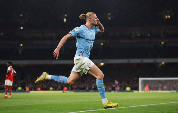 Erling Haaland of Manchester City celebrates after scoring the team's third goal during the Premier League match between Arsenal FC and Manchester...