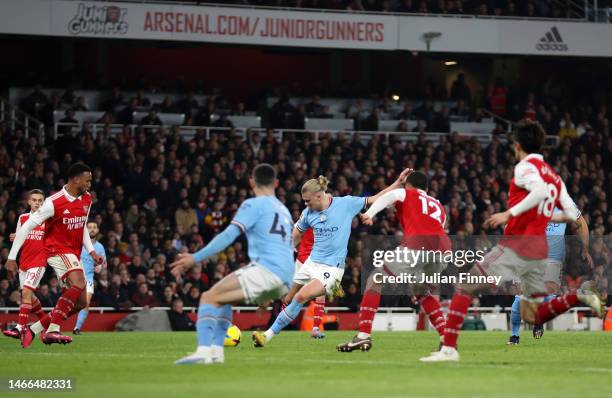 Erling Haaland of Manchester City scores the team's third goal during the Premier League match between Arsenal FC and Manchester City at Emirates...