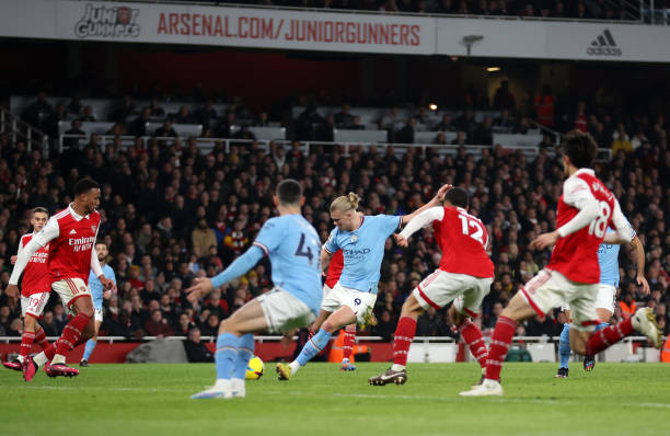 Erling Haaland of Manchester City scores the team's third goal during the Premier League match between Arsenal FC and Manchester City at Emirates...