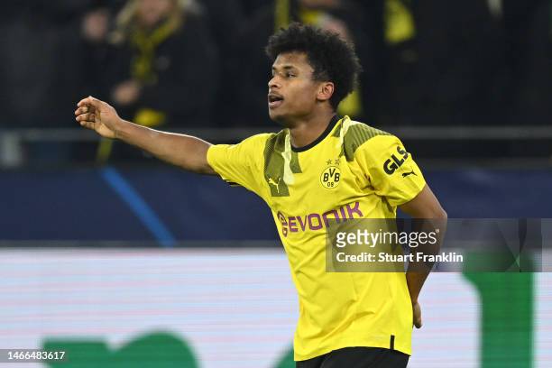 Karim Adeyemi of Borussia Dortmund celebrates after scoring the team's first goal during the UEFA Champions League round of 16 leg one match between...