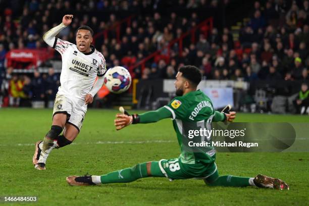 Cameron Archer of Middlesbrough scores the team's third goal past Wes Foderingham of Sheffield United during the Sky Bet Championship between...