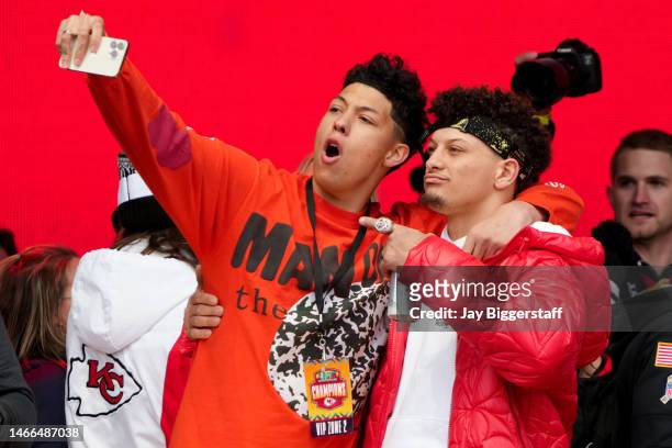 Jackson Mahomes and Patrick Mahomes of the Kansas City Chiefs celebrate on stage during the Kansas City Chiefs Super Bowl LVII victory parade on...