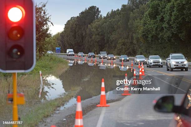 Queue of cars leaves Napier after one road out is reopened on February 16, 2023 in Napier, New Zealand. Cyclone Gabrielle has caused widespread...