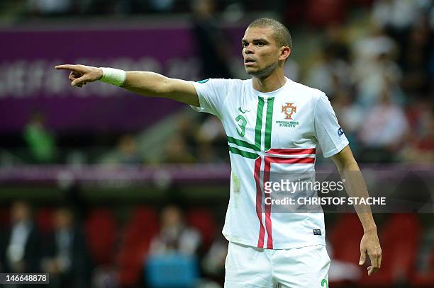 Portuguese defender Pepe gestures during the Euro 2012 football championships quarter-final match the Czech Republic vs Portugal on June 21, 2012 at...