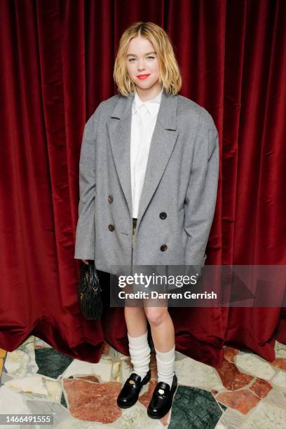 Milly Alcock attends the Miu Miu Women's Tales Dinner on February 15, 2023 in London, England.