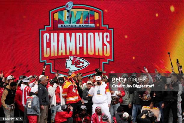 Travis Kelce and Patrick Mahomes of the Kansas City Chiefs celebrate on stage with teammates during the Kansas City Chiefs Super Bowl LVII victory...
