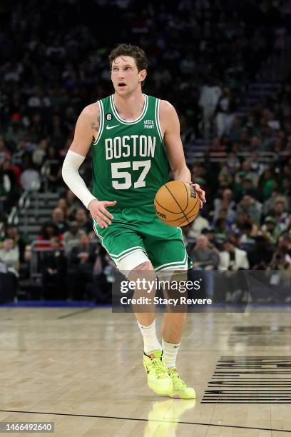 Mike Muscala of the Boston Celtics handles the ball during a game against the Milwaukee Bucks at Fiserv Forum on February 14, 2023 in Milwaukee,...