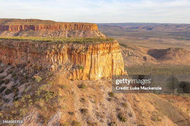 sunset over the cockburn range - helicopter view stock pictures, royalty-free photos & images