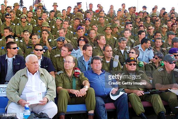 Israeli Prime Minister Ariel Sharon , Army Chief of Staff Lt. Gen. Moshe Yaalon and Defense Minister Binyamin Ben Eliezer watch an army exercise...