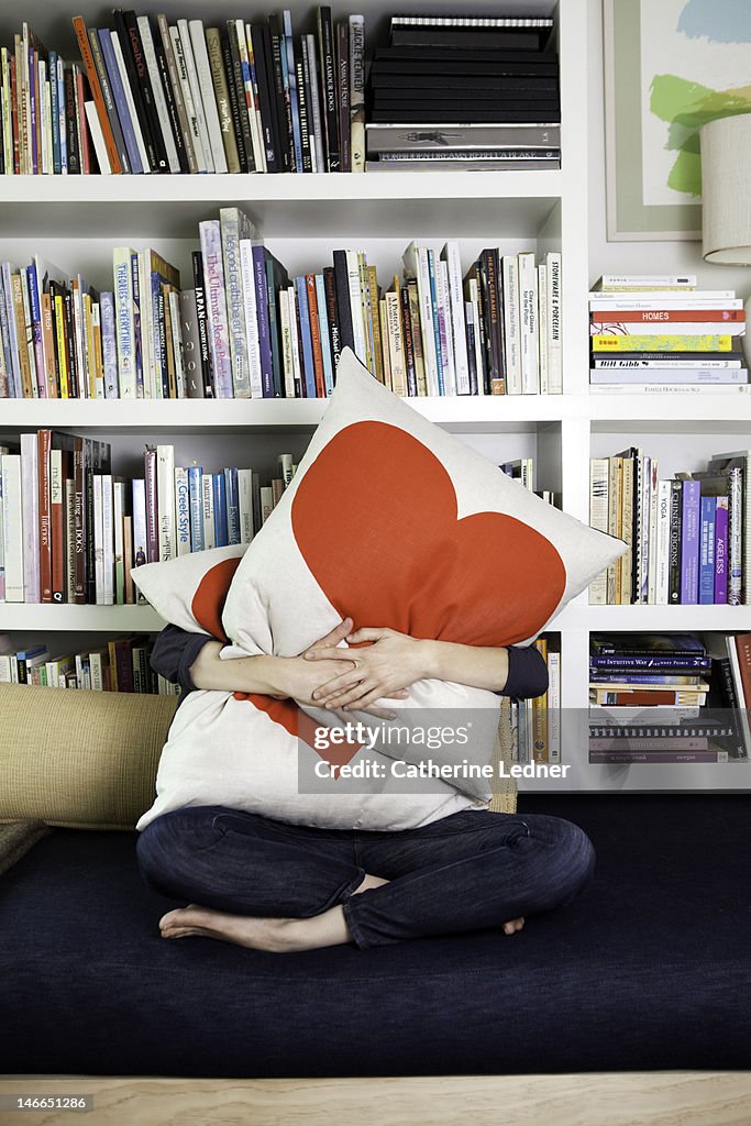 Woman Hugging heat pillows