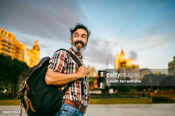 mature commuter walking to work at sunrise - buenos aires travel stock pictures, royalty-free photos & images