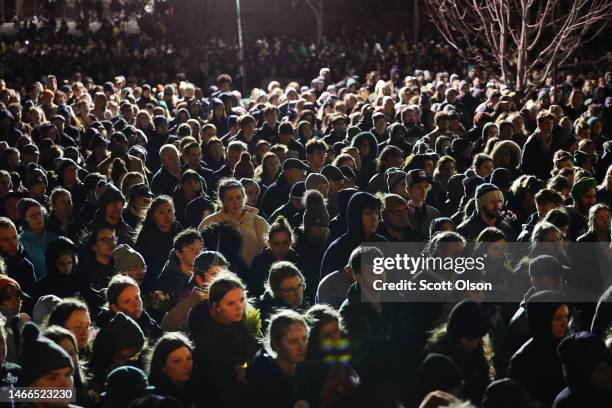 Students, faculty and others in the community attend a vigil on the campus of Michigan State University following Monday's shooting on February 15,...