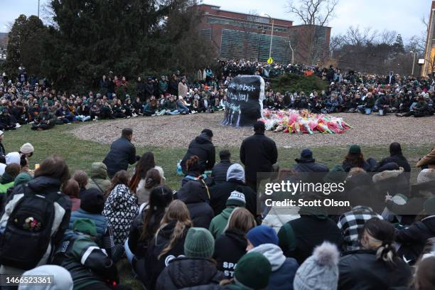 Students, faculty and others in the community attend a vigil on the campus of Michigan State University following Monday's shooting on February 15,...