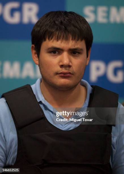 Kevin Daniel Beltran Rios during their presentation to the media in Mexico City, Mexico on June 21, 2012. Mexican marines detained Jesus Alfredo...