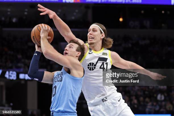 Luke Kennard of the Memphis Grizzlies goes to the basket during the first half against Kelly Olynyk of the Utah Jazz at FedExForum on February 15,...