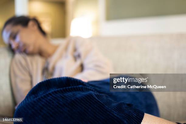 black woman napping on sofa - unconscious stock pictures, royalty-free photos & images