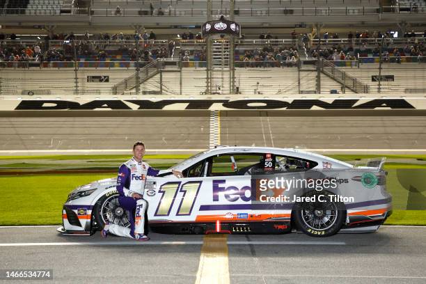 Denny Hamlin, driver of the FedEx 50 Toyota, poses on the track during qualifying for the Busch Light Pole at Daytona International Speedway on...