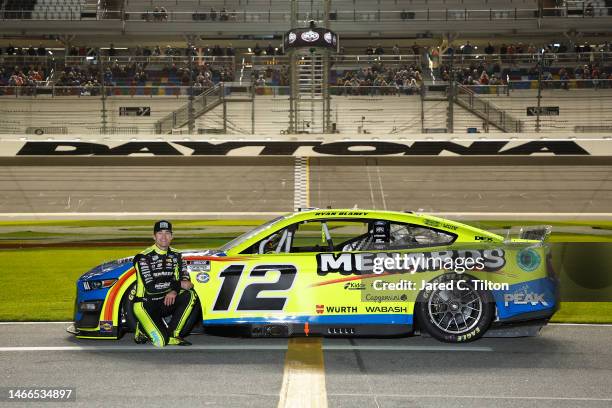 Ryan Blaney, driver of the Menards/Blue DEF/PEAK Ford, poses on the track during qualifying for the Busch Light Pole at Daytona International...